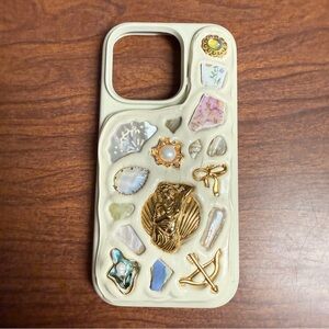Artistic Cream iPhone 16 Pro Case with Gold and Multicolor Details